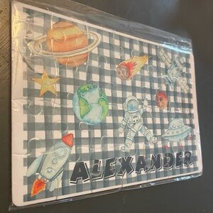 Space-Themed Puzzle with Astronauts and Planets with Alexander on it